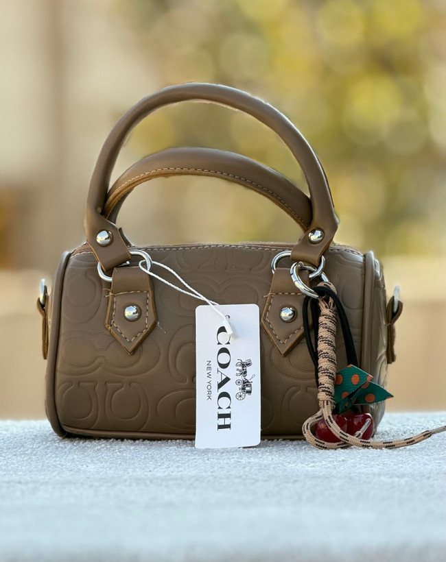 کیف دخترانه دستی / دوشی مدل صندوقی جنس چرم مصنوعی طرح کوچ (Coach)