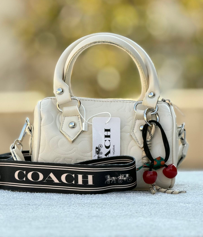 کیف دخترانه دستی / دوشی مدل صندوقی جنس چرم مصنوعی طرح کوچ (Coach)