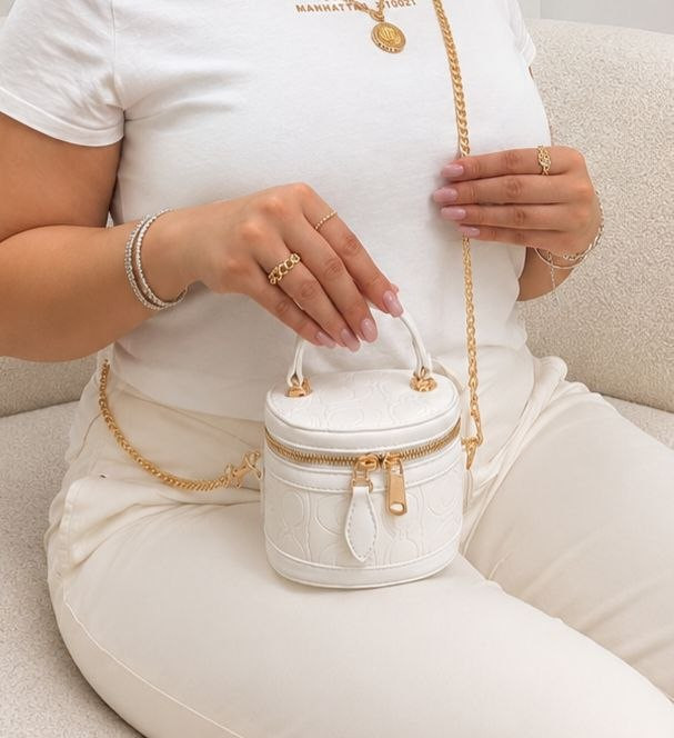 کیف دخترانه دستی و دوشی مدل گرد صندوقی طرح کوچ (Coach) جنس چرم مصنوعی